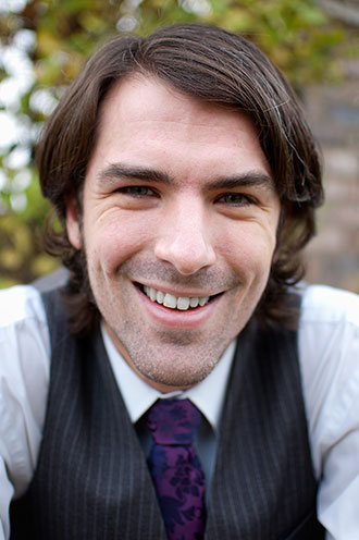 Photo of the author, smiling and looking rather dapper, if I do say so myself